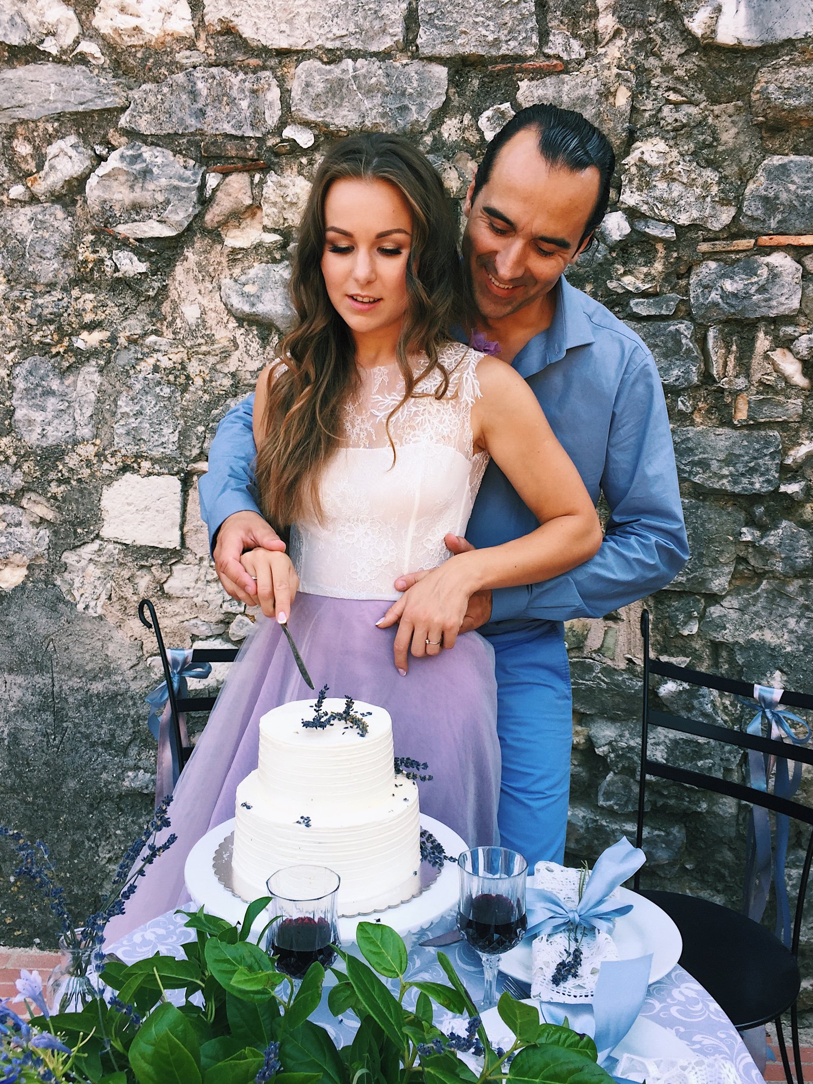 The newlyweds cutting their wedding cake